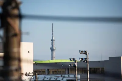 a building with a tower on top of it at Exclusive Accommodation 9bicycle 9ppl in Tokyo