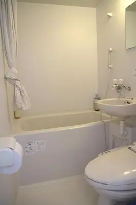 a bathroom with a toilet and a sink and a tub at \u4e0a\u91ce\u4e4b\u5bb6\u5206\u9928\u5bb6\u5ead\u623f in Tokyo