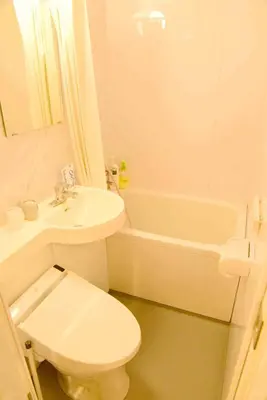 a bathroom with a toilet and a sink and a tub at \u4e0a\u91ce\u4e4b\u5bb6Vip\u5bb6\u5ead\u623f in Tokyo