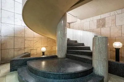 a spiral staircase in a building with a circular ceiling at Tabist Hotel Mercury Asakusabashi in Tokyo