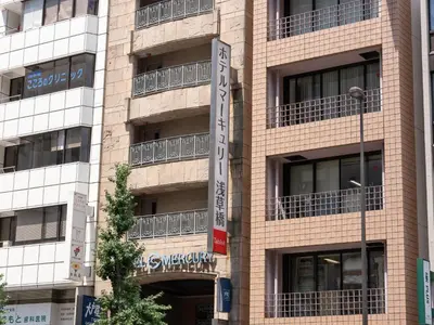 a building with a sign on the side of it at Tabist Hotel Mercury Asakusabashi in Tokyo