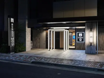 an entrance to a building at night at MONday Apart Premium AKIHABARA ASAKUSABASHI Sta. in Tokyo