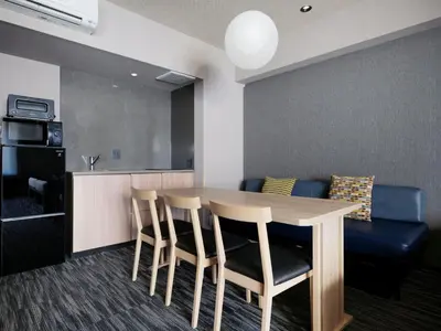 a dining room with a table and chairs at MONday Apart Premium AKIHABARA in Tokyo