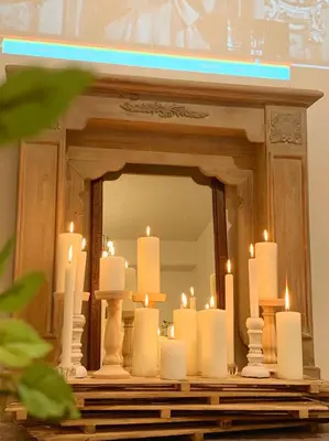 a group of candles in front of a mirror at Meee Kameari in Tokyo