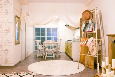 a kitchen with a table and a window at Meee Kameari in Tokyo