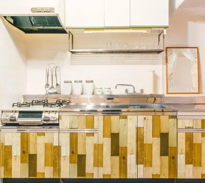 a kitchen with a sink and a stove at Meee Kameari in Tokyo