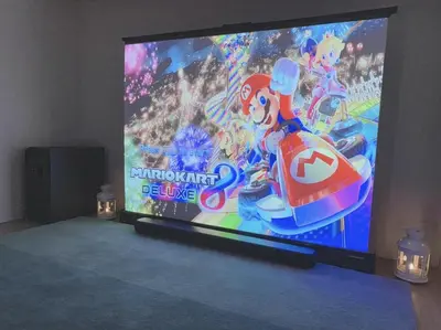 a large screen television with a video game on it at LacQuer House ASAKUSA 2 in Tokyo