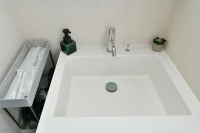 a bathroom sink with a faucet on top of it at LacQuer House ASAKUSA 2 in Tokyo