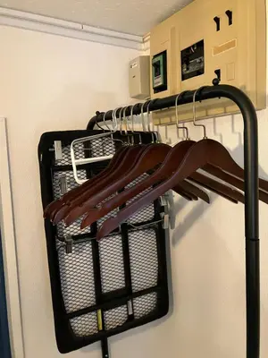 a shopping cart with umbrellas in a closet at HOTEL THE SPACE in Tokyo