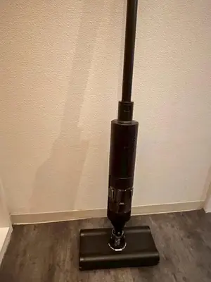 a black object sitting on the floor next to a wall at HOTEL THE SPACE in Tokyo