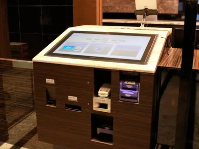 a cash register with a screen on top of it at APA Hotel Shinagawa Togoshi Ekimae in Tokyo