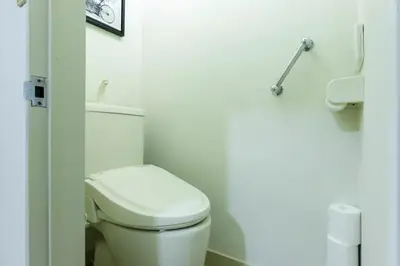 a bathroom with a white toilet in a room at NAVI Azabujuban in Tokyo