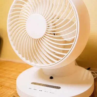 a white fan sitting on top of a table at Japanese Modern House in Shinagawa in Tokyo