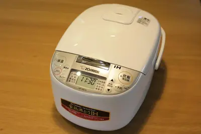 a white computer mouse sitting on top of a table at Sumida Base in Tokyo