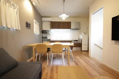 a kitchen and dining room with a table and chairs at Sumida Base in Tokyo