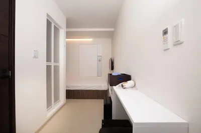 a small room with a bed and a window at Mutsumi Building - Vacation STAY 00543v in Tokyo