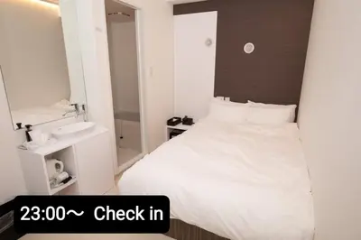 a bedroom with a white bed and a sink at Mutsumi Building - Vacation STAY 00543v in Tokyo