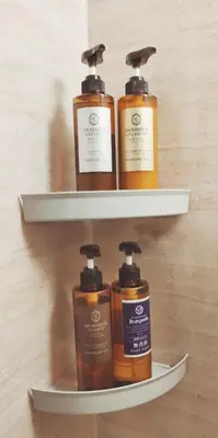a group of four bottles of soap on shelves at Mutsumi Building - Vacation STAY 00543v in Tokyo
