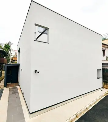 a white building with a window on the side of it at 634 Condo Shinjuku - Vacation STAY 01910v in Tokyo