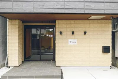 a door to a building with a who sign on it at winco - Vacation STAY 06648v in Tokyo