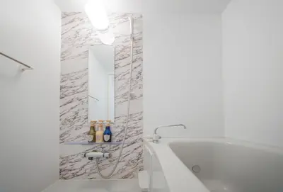 a white bathroom with a tub and a mirror at winco - Vacation STAY 06648v in Tokyo