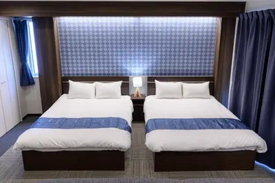 a hotel room with two beds and a window at winco - Vacation STAY 06658v in Tokyo