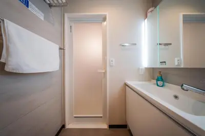 a bathroom with a sink and a mirror at winco - Vacation STAY 06658v in Tokyo