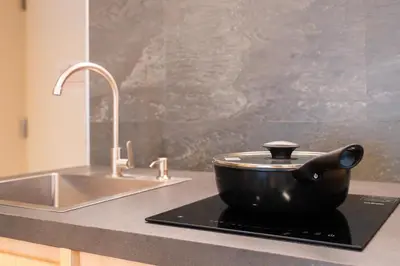 a black pot sitting on top of a stove next to a sink at winco - Vacation STAY 06660v in Tokyo