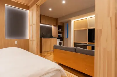 a bedroom with a large bed and a television at winco - Vacation STAY 06660v in Tokyo
