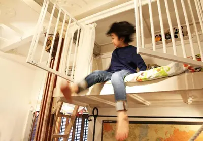 a young boy sitting on a bunk bed at TOKYO Ebisu! 2adults & 2kids Max4ppl FamilyOK! in Tokyo