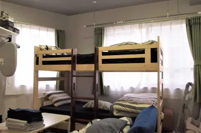 two bunk beds in a room with a window at Belle harmonie togoshi203 in Tokyo