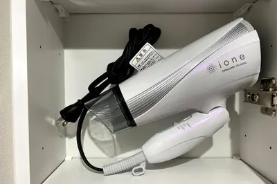 a electric hairdryer in a drawer at Belle harmonie togoshi203 in Tokyo