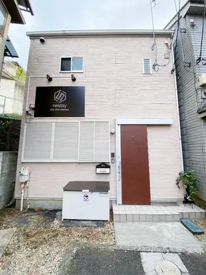a house with a door and a garage at nestay villa tokyo takanawa in Tokyo