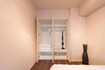 a room with a closet with a bed and a vase at HIZ HOTEL - Vacation STAY 08966v in Tokyo