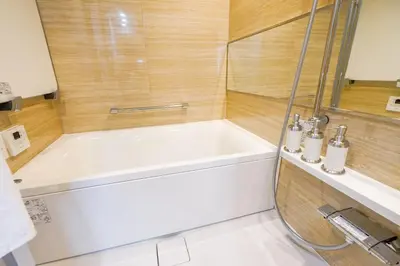 a white bath tub in a bathroom with a shower at HIZ HOTEL - Vacation STAY 08966v in Tokyo