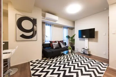 a living room with a couch and a tv at HIZ HOTEL - Vacation STAY 08966v in Tokyo