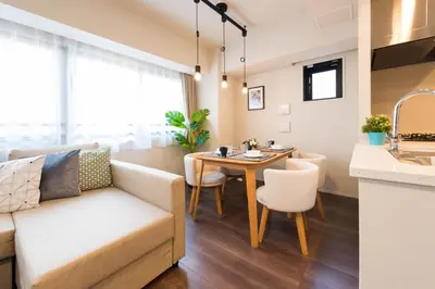 a living room and kitchen with a couch and a table at HIZ HOTEL - Vacation STAY 08955v in Tokyo