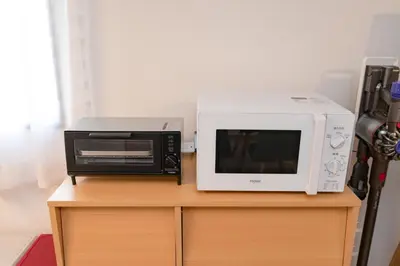 a microwave and a toaster oven sitting on a table at Serendipity Koiwa - Vacation STAY 11031v in Tokyo