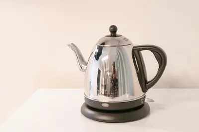 a black and silver tea kettle sitting on a table at Serendipity Koiwa - Vacation STAY 11031v in Tokyo