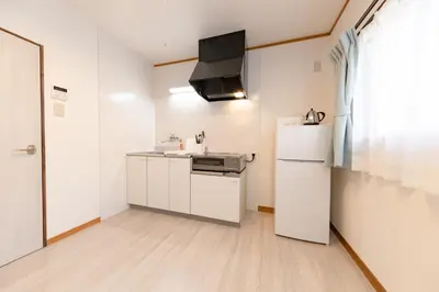 a white kitchen with a refrigerator and a sink at Serendipity Koiwa - Vacation STAY 11031v in Tokyo