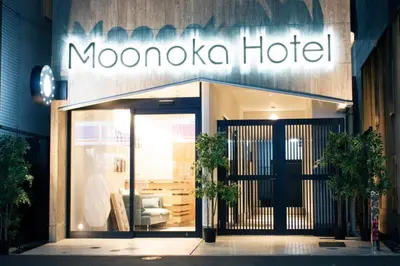 a moxico hotel sign on the side of a building at Monoka Hotel Ginza in Tokyo