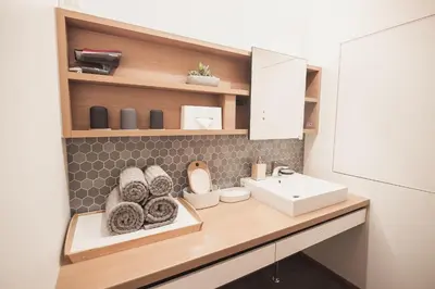 a bathroom with a sink and a counter at Monoka Hotel Ginza in Tokyo