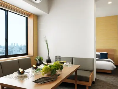 a dining room with a table and a bedroom at MIMARU Tokyo Asakusa Station in Tokyo