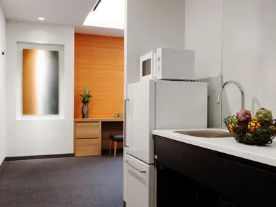 a kitchen with a sink and a white refrigerator at MIMARU Tokyo Asakusa Station in Tokyo