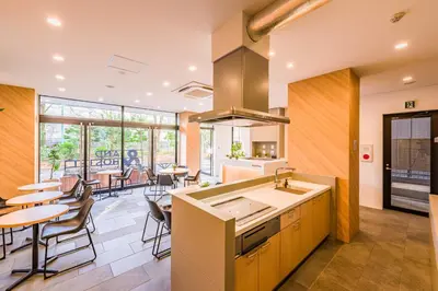 a kitchen with a sink and a counter top at &AND HOSTEL ASAKUSA KAPPABASHI in Tokyo