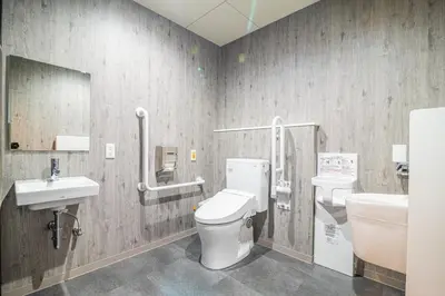 a bathroom with a toilet and a sink at Wise Owl Hostels River Tokyo in Tokyo