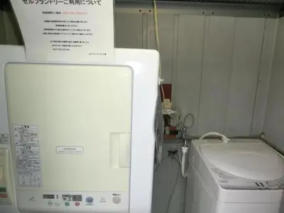 a white refrigerator and a washing machine in a kitchen at Hotel Suntargas Otsuka - Vacation STAY 08518v in Tokyo