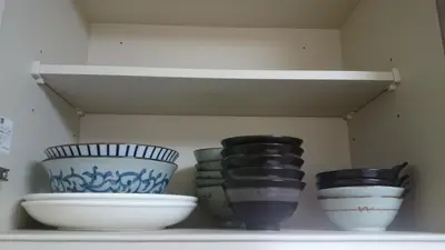 three bowls are sitting on a shelf at Isshuku Ryokan Asakusabashi - Vacation STAY 13125v in Tokyo