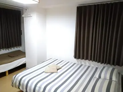 a bedroom with a bed with a towel on it at Isshuku Ryokan Asakusabashi - Vacation STAY 13125v in Tokyo
