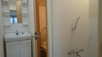 a white bathroom with a sink and a toilet at Isshuku Ryokan Asakusabashi - Vacation STAY 13125v in Tokyo